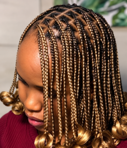a lady carrying a golden braid